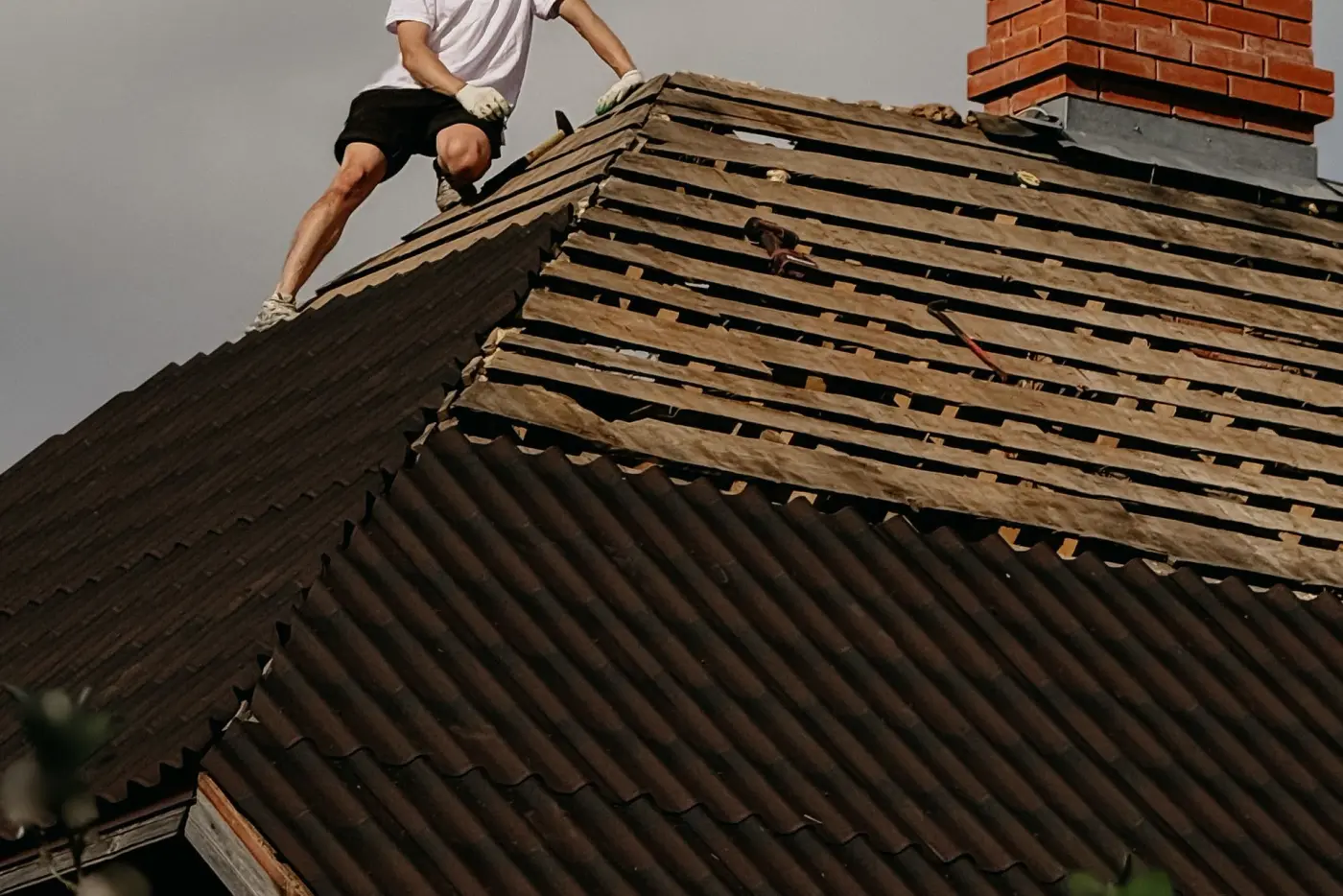 Close inspection of a tiled roof during a home survey